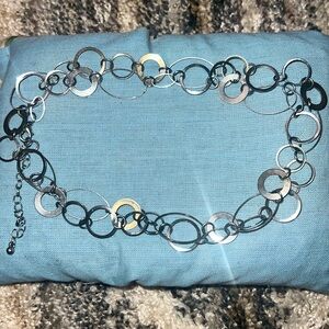 This is a silver tie around belt or waist jewelry.
